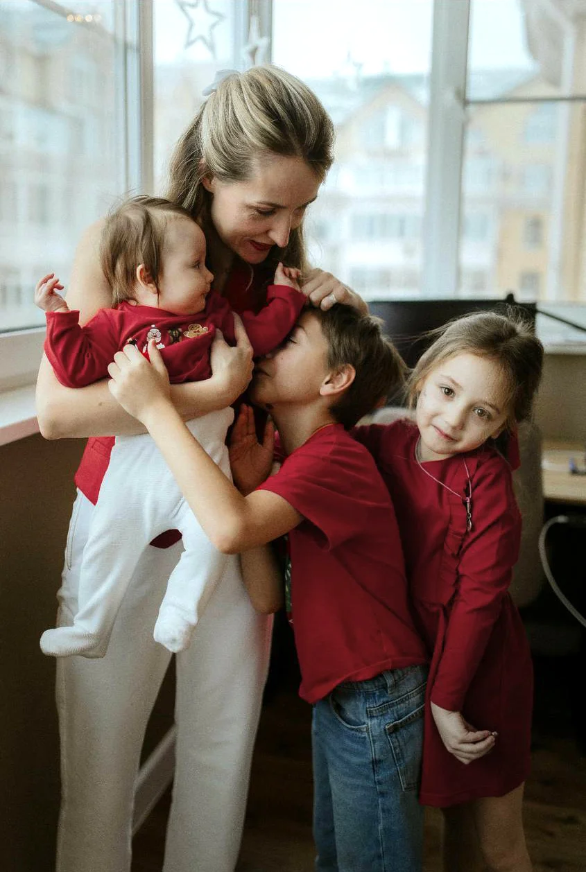 Happy woman with three children